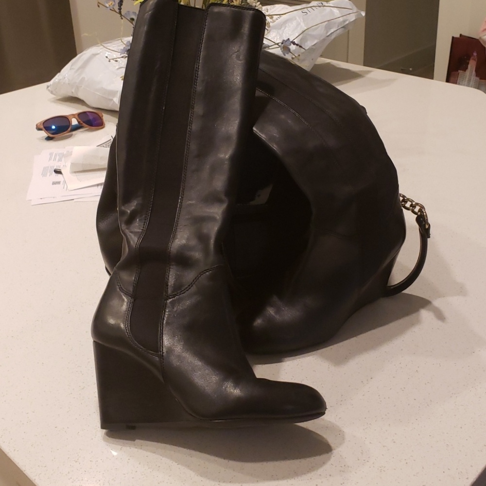 Knee high leather boots with wedge heel